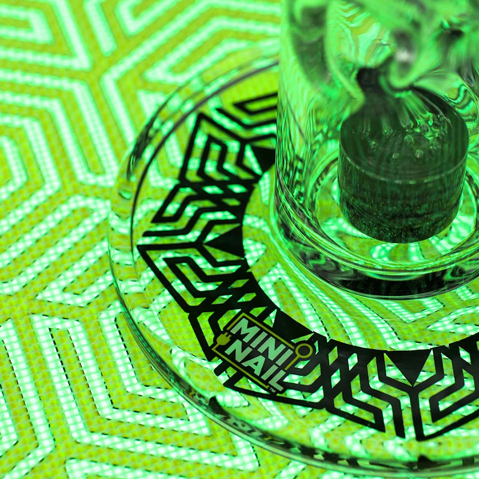 Closeup of MiniNail Multi-Color Backlit SlabPad Shown in Green with Glass Rig