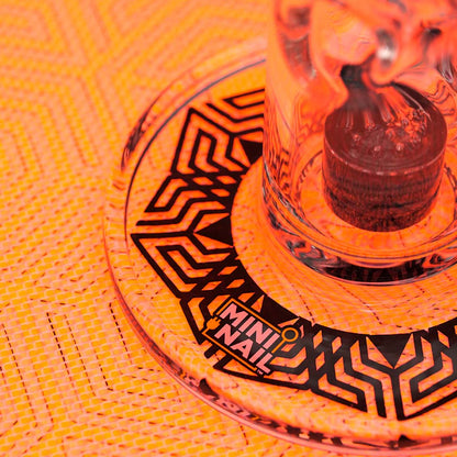 Closeup of MiniNail Multi-Color Backlit Slab Pad Shown in Red with Glass Rig