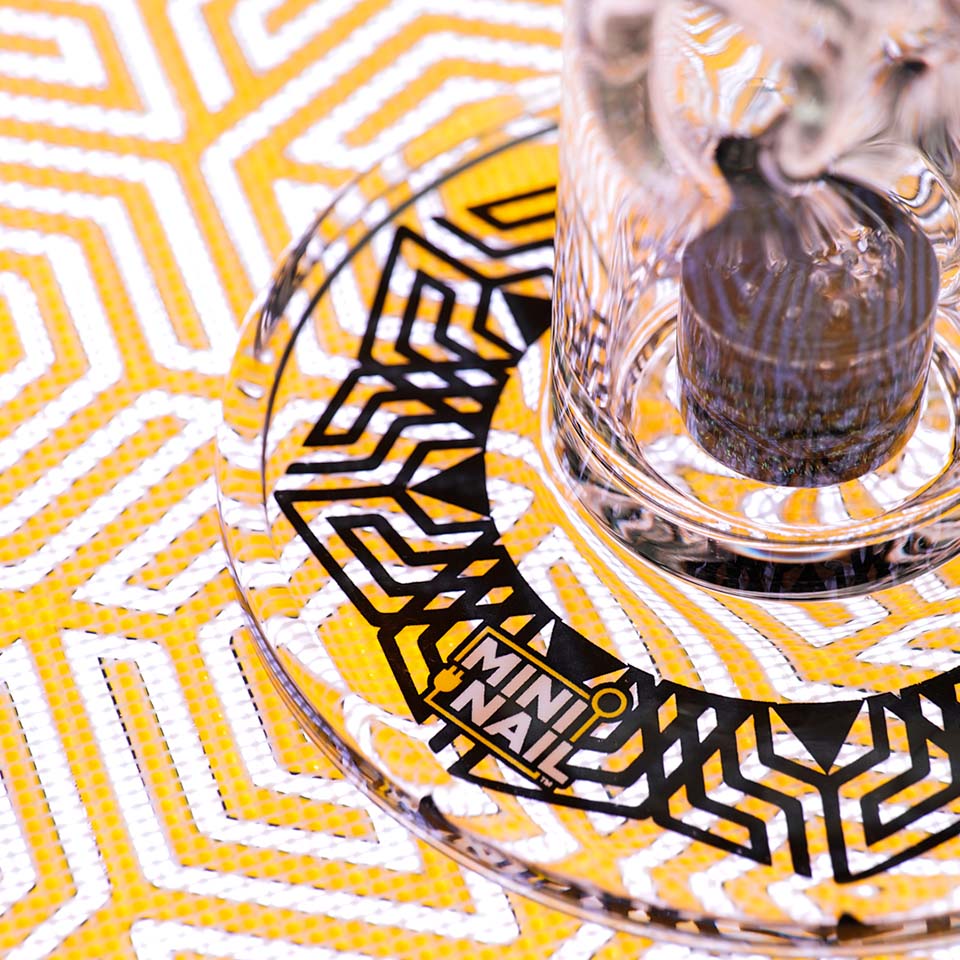 Closeup of MiniNail Multi-Color Backlit Slab Pad Shown in White with Glass Rig