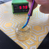 Close up using Rainbow MiniNail Multi-tip Dabber and Carb Cap Interchangeable Sword Tip